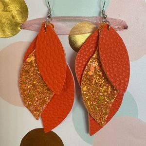 NWT Faux Leather Dangle Earrings. Orange, 3 layers.